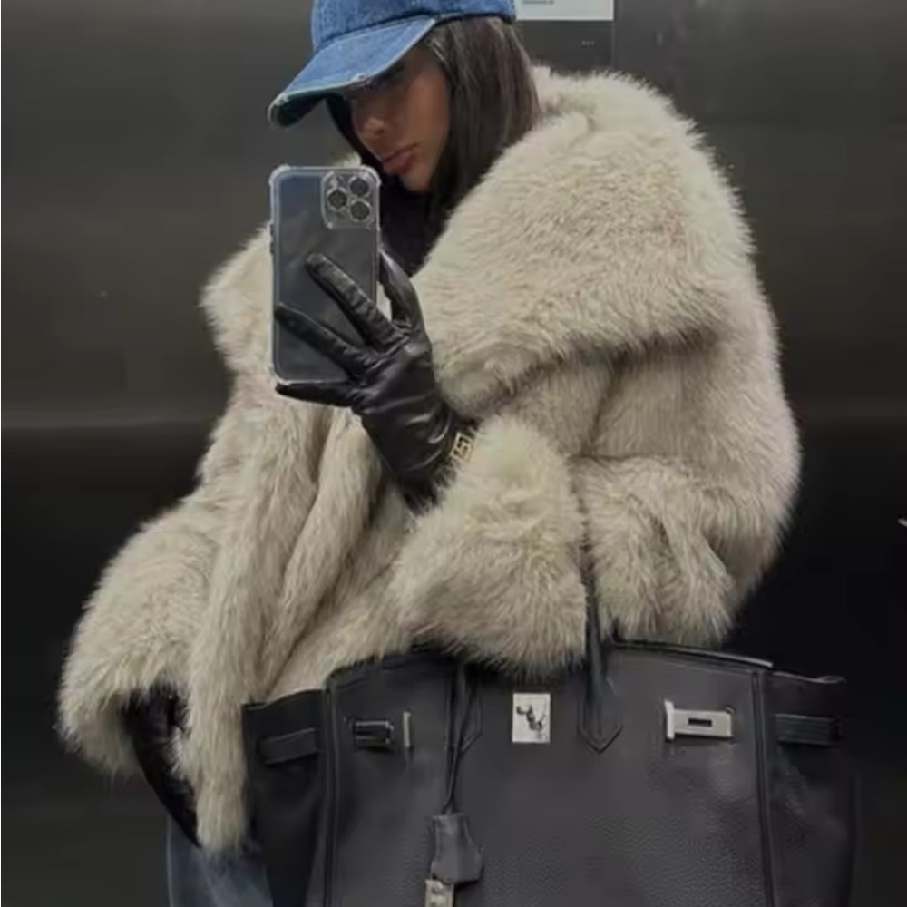 Faux fur gray coat with pockets & snaps. Like new, worn 1 time.